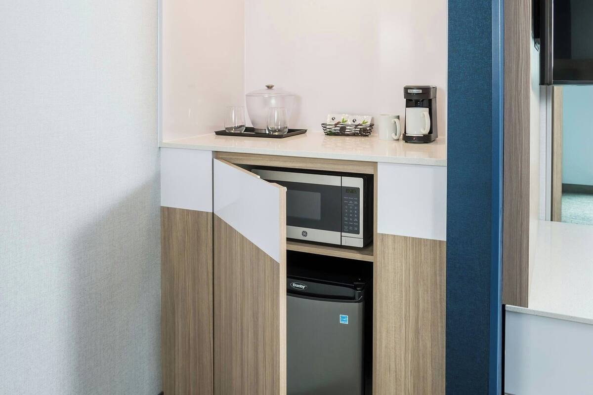 desk, laptop workspace, blackout curtains, iron/ironing board