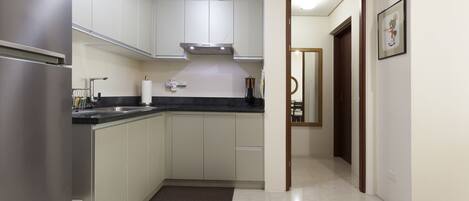 Fridge, microwave, stovetop, coffee/tea maker