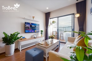 Premier Apartment, 2 Bedrooms, Sea View, Beachfront | Living room | 40-inch Smart TV with cable channels, TV