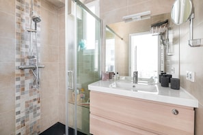 Shower, hair dryer, towels, soap