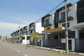 Residents enjoy balconies with glass railings, offering outdoor space to relax.
