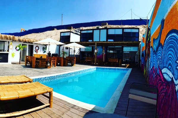 Outdoor pool, open 9:00 AM to 9:00 PM, pool umbrellas, pool loungers