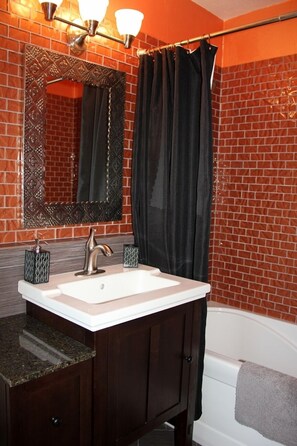 Combined shower/bathtub, hair dryer, towels, soap