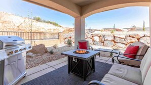 An outdoor patio with a grill, a fire pit, and seating. - Arcade Adventure, LOADED WITH EXTRAS, Come Play! (Washington)
