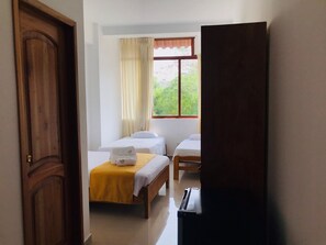 Family Triple Room, Multiple Beds (Air Conditioner) | Minibar, in-room safe, free WiFi, bed sheets - Posada del Ángel Hotel (Tarapoto)