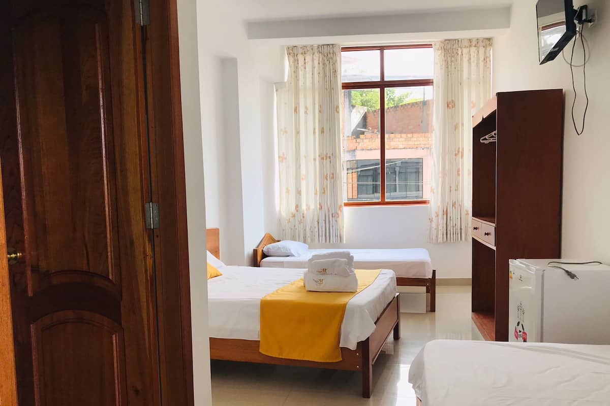 Family Triple Room, Multiple Beds (Air Conditioner) | Minibar, in-room safe, free WiFi, bed sheets