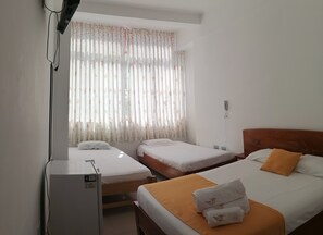 Family Triple Room, Multiple Beds (Air Conditioner) | Minibar, in-room safe, free WiFi, bed sheets - Posada del Ángel Hotel (Tarapoto)