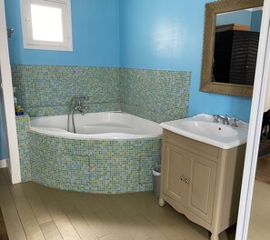 Bathtub, hair dryer, towels, soap