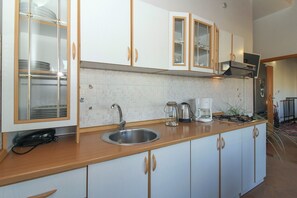 Fridge, coffee/tea maker, toaster, cookware/dishes/utensils