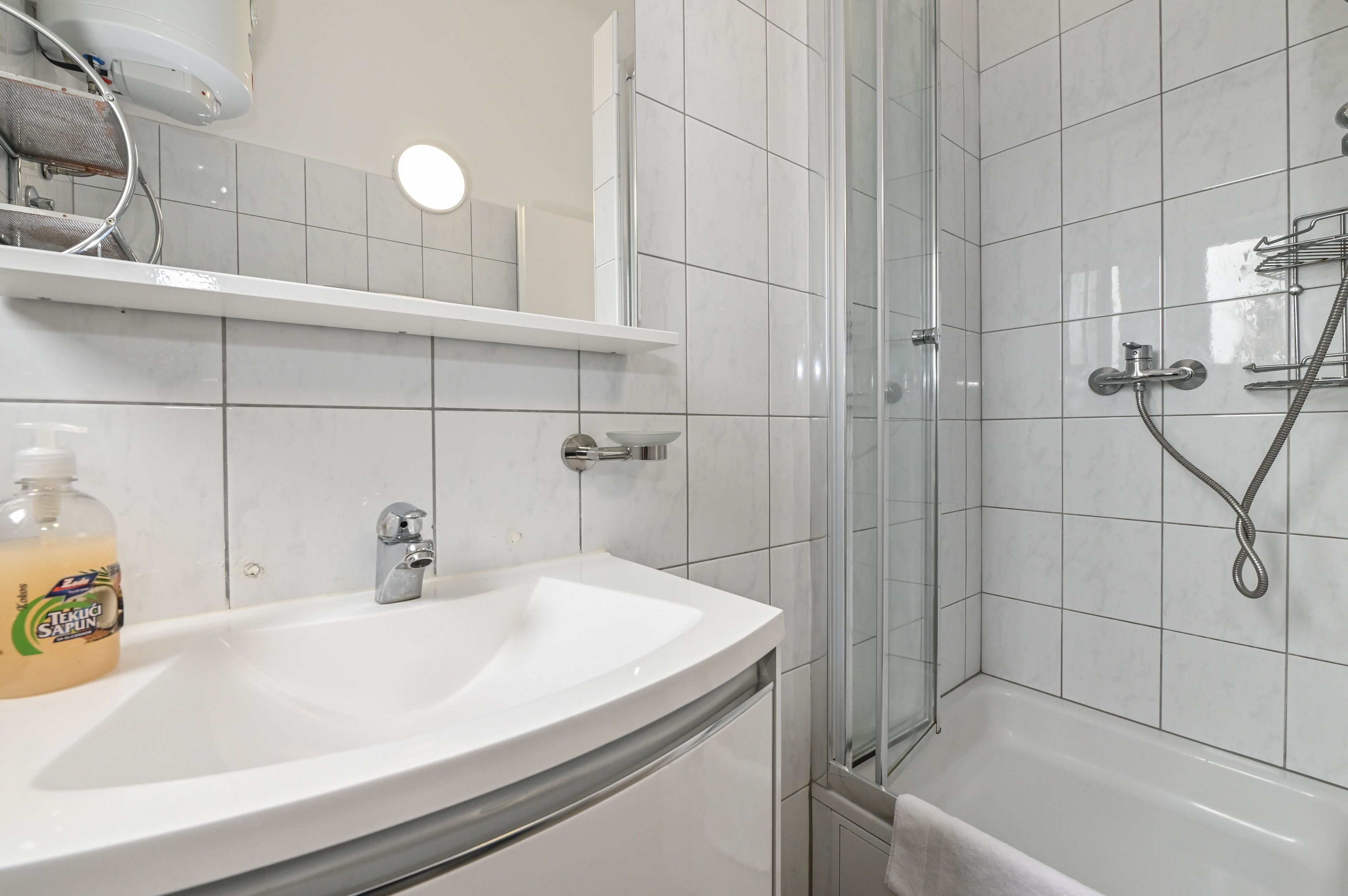 Bathtub, hair dryer, towels, soap