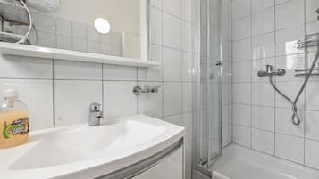Bathtub, hair dryer, towels, soap