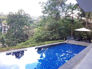 Outdoor pool, pool umbrellas, pool loungers