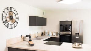A modern kitchen with a built-in oven, microwave, and refrigerator. - In nature, 3 bedroom house sleeps 8-10, totally renovated in 2019 (Aouste-sur-Sye)