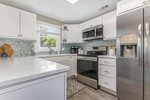 Fridge, microwave, oven, stovetop - Downtown Charmer with Amenities Galore, Upper (Grand Haven)