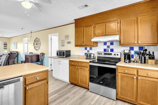 Fridge, microwave, oven, stovetop - Out of the Blue: Classic, Dog-friendly, Ocean View Beach Cottage with Fenced Yar (Oak Island)