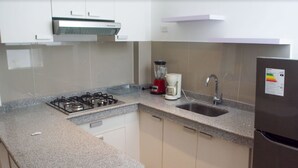 Family Apartment, Multiple Beds | Private kitchen | Coffee/tea maker, cookware/dishes/utensils - Basadre Apart Hotel (Tacna)