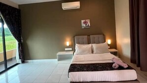 A bedroom with a large bed, bedside tables, an air conditioning unit, and a view through the window. - Nahdhoh Langkawi Resort (Langkawi)