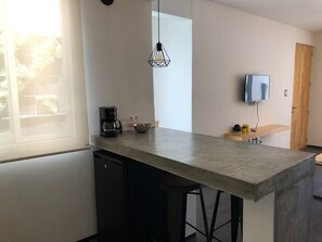 Fridge, stovetop, coffee/tea maker, cookware/dishes/utensils