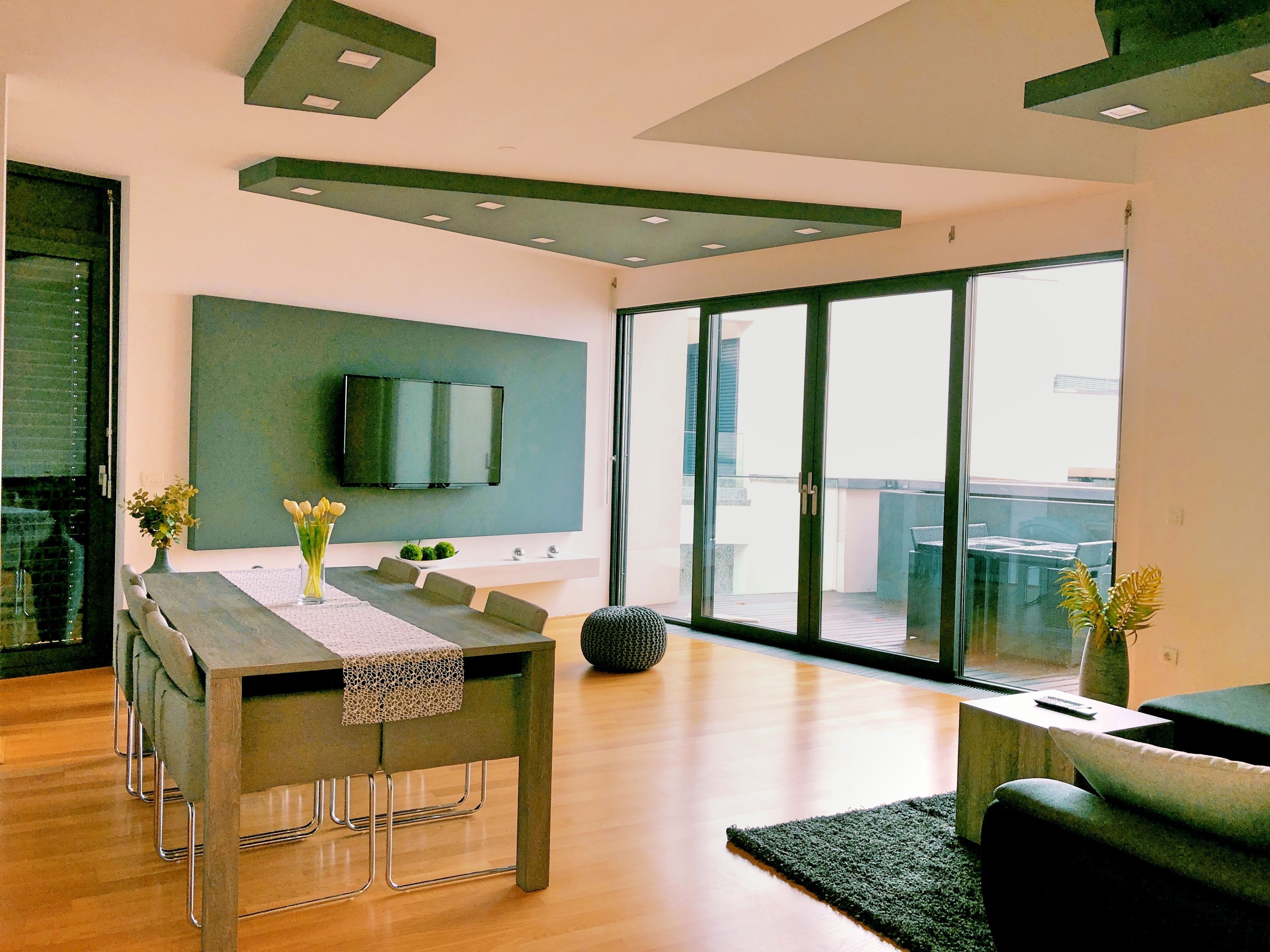 Apartment, Sea View | Living area | Flat-screen TV