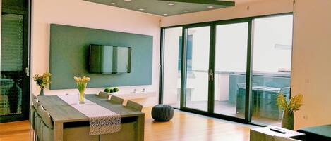 Apartment, Sea View | Living area | Flat-screen TV