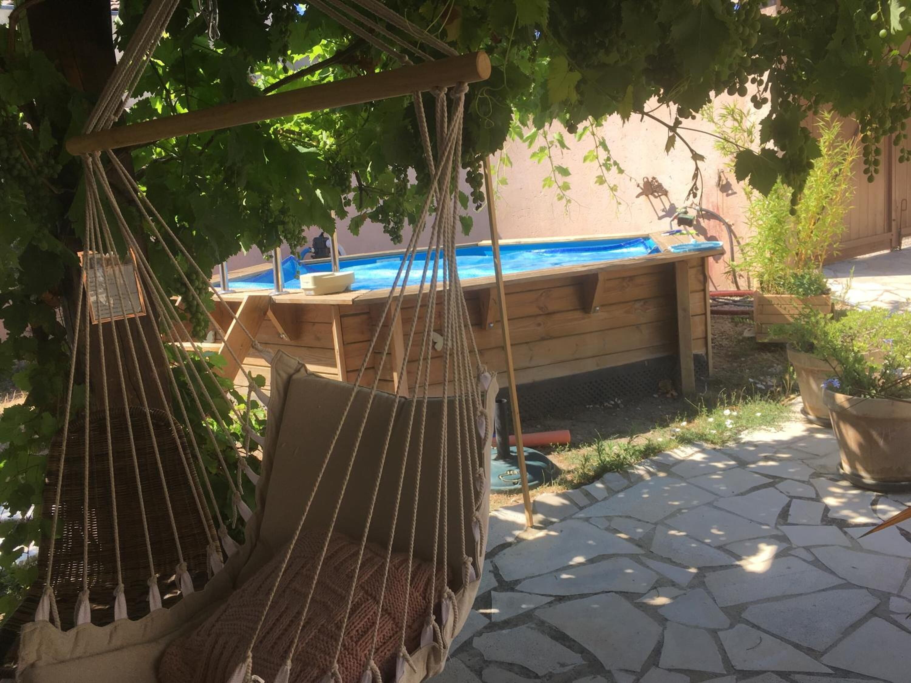 Seasonal outdoor pool, open noon to 8:00 PM, pool umbrellas