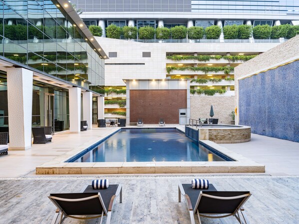 Indoor pool, outdoor pool, open 9:00 AM to 9:00 PM, pool loungers