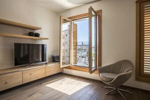 Deluxe Studio Suite with Sea View (Annex building: Drazanac 1a) | Living area | Flat-screen TV, fireplace - Seaview Luxury Retreat (Split)
