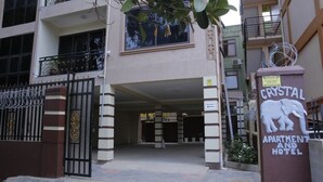 A building entrance with a sign for 'Crystal Apartment and Hotel'. - Crystal Hotel Apartments Entebbe (Entebbe)