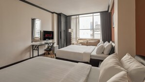 Family Room, City View | Minibar, in-room safe, desk, blackout curtains - The One Premium Hotel (Ho Chi Minh City)