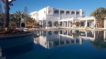 Indoor pool, outdoor pool, pool umbrellas, pool loungers