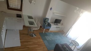 Apartemen, 1 kamar tidur | Area keluarga | TV layar datar