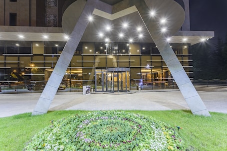 Front of property - evening/night. Shimall Hotel