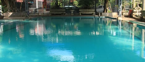 Seasonal outdoor pool, pool loungers