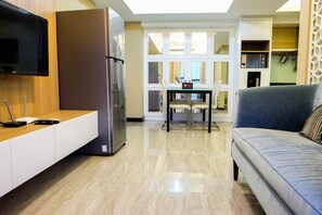 Room | Living area | TV - Amazing 2BR with City View The Wave Apartment (Jakarta)