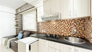 Private kitchen - Strategic and Cozy 2BR Bassura City Apartment (Jakarta)
