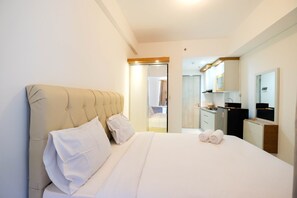 Room | Desk, bed sheets - Gorgeous Studio Apartment at Akasa Pure Living BSD (South Tangerang)