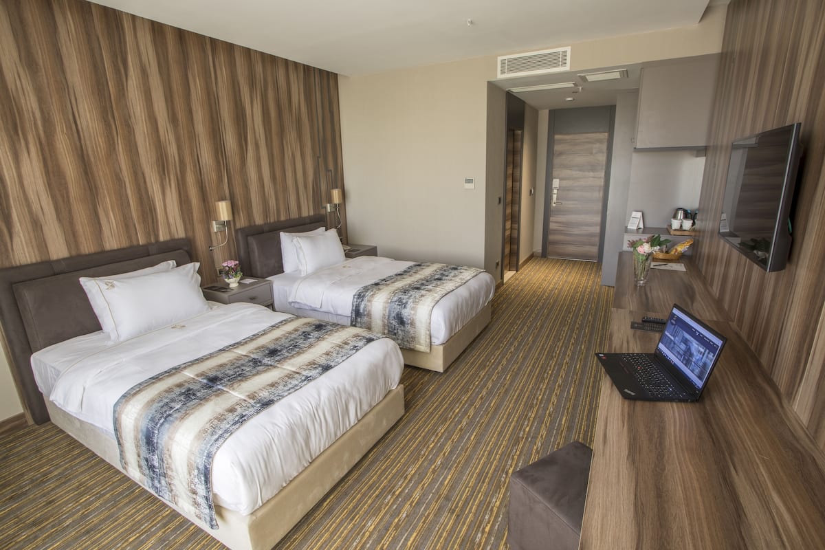 Standard Twin Room, 2 Single Beds, City View | Minibar, in-room safe, laptop workspace, soundproofing