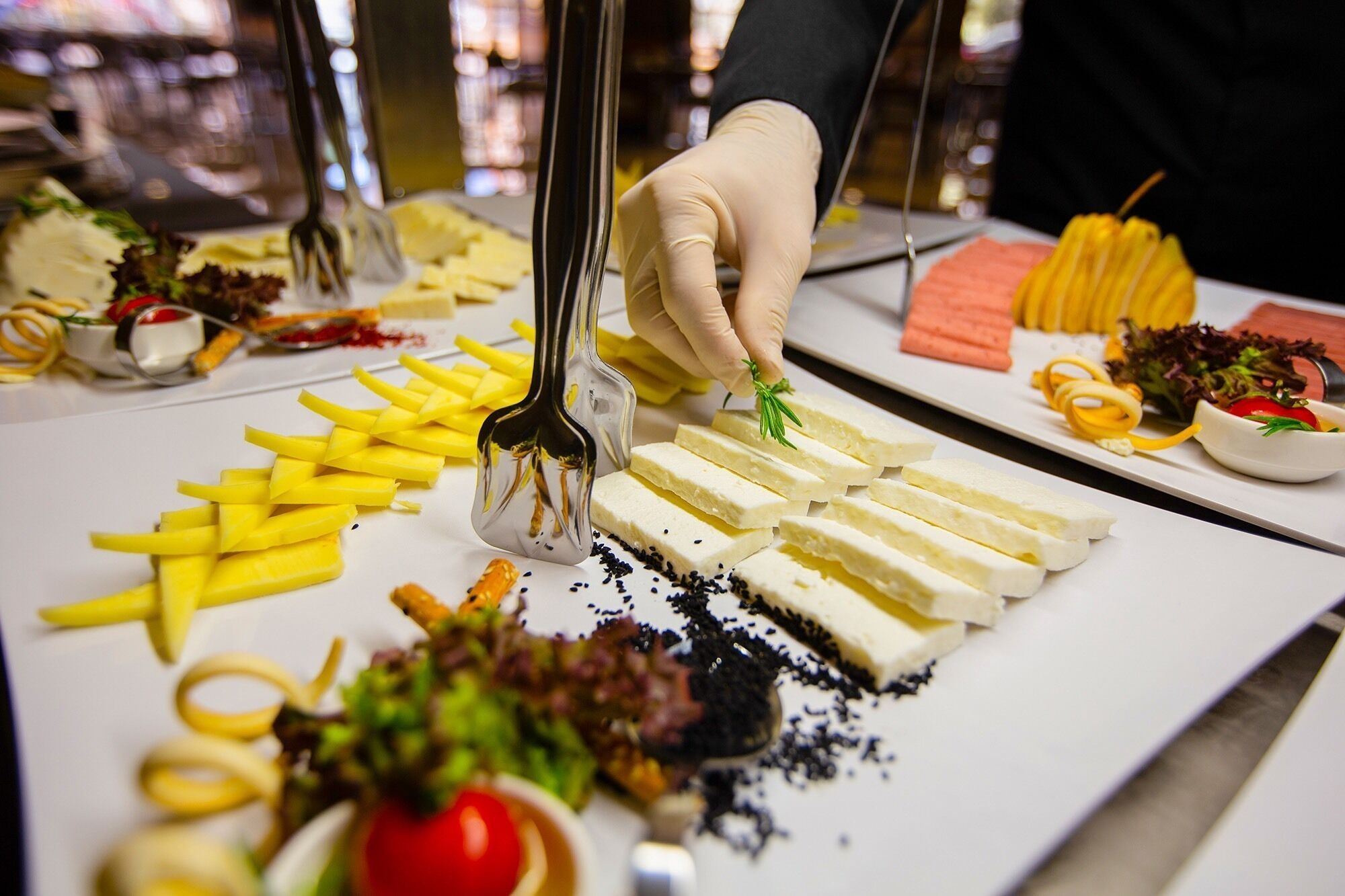 A food display with various items including cheese, fries, and vegetables.