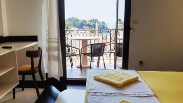 Apartamento conforto, vista para o mar | Wi-Fi de cortesia, roupa de cama
