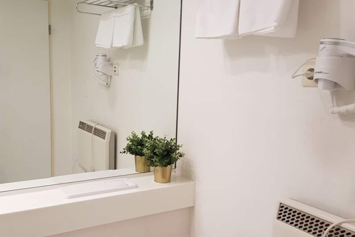 deep-soaking bathtub, free toiletries, hair dryer, towels