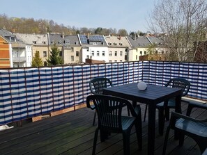 Relax on the deck with a view of the surrounding neighborhood.