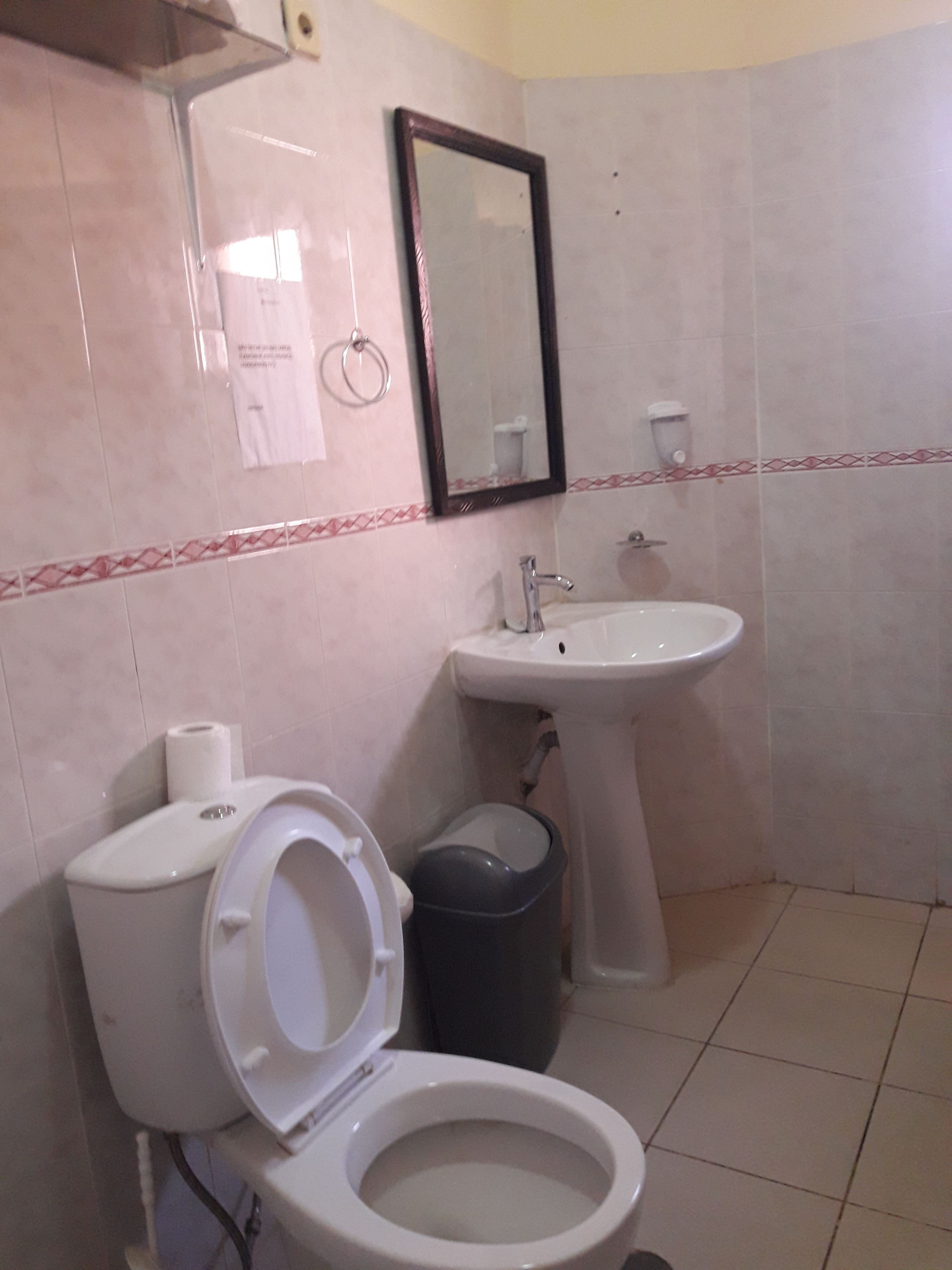 Economy Room, 1 Double Bed | Bathroom | Shower, rainfall showerhead, free toiletries, slippers