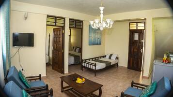 Standard Apartment, 2 Bedrooms | Living area | TV