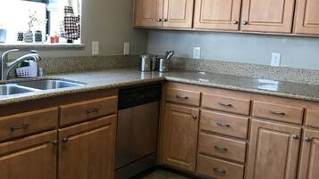 Microwave, dishwasher, coffee/tea maker, cookware/dishes/utensils