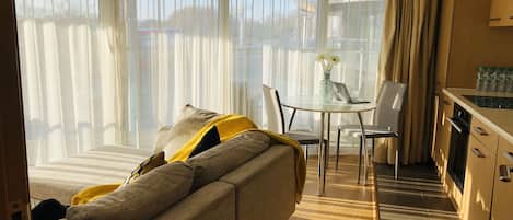 Luxury Apartment, 1 Queen Bed | Living area | Flat-screen TV
