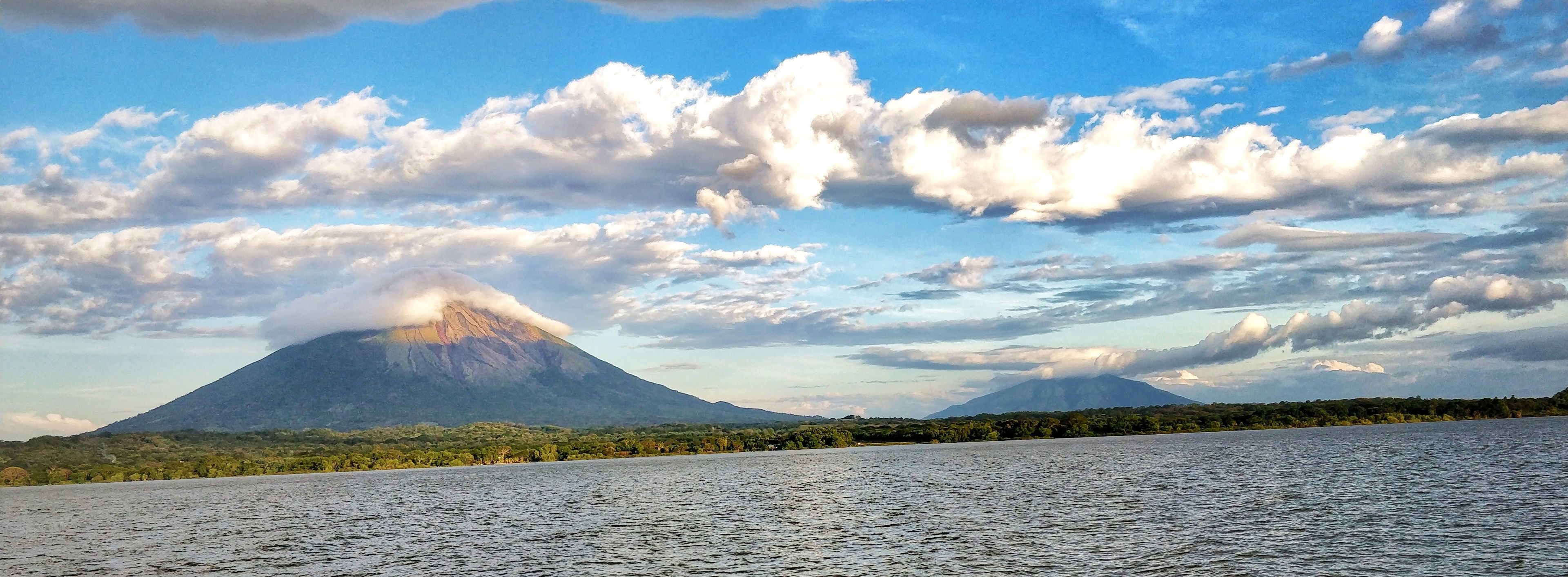 A lake with a mountain in the background.