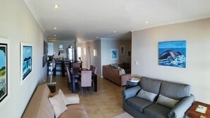 Apartment, 3 Bedrooms | Living area | 32-inch flat-screen TV with satellite channels, TV - Sunset View at Whale Cove (De Kelders)