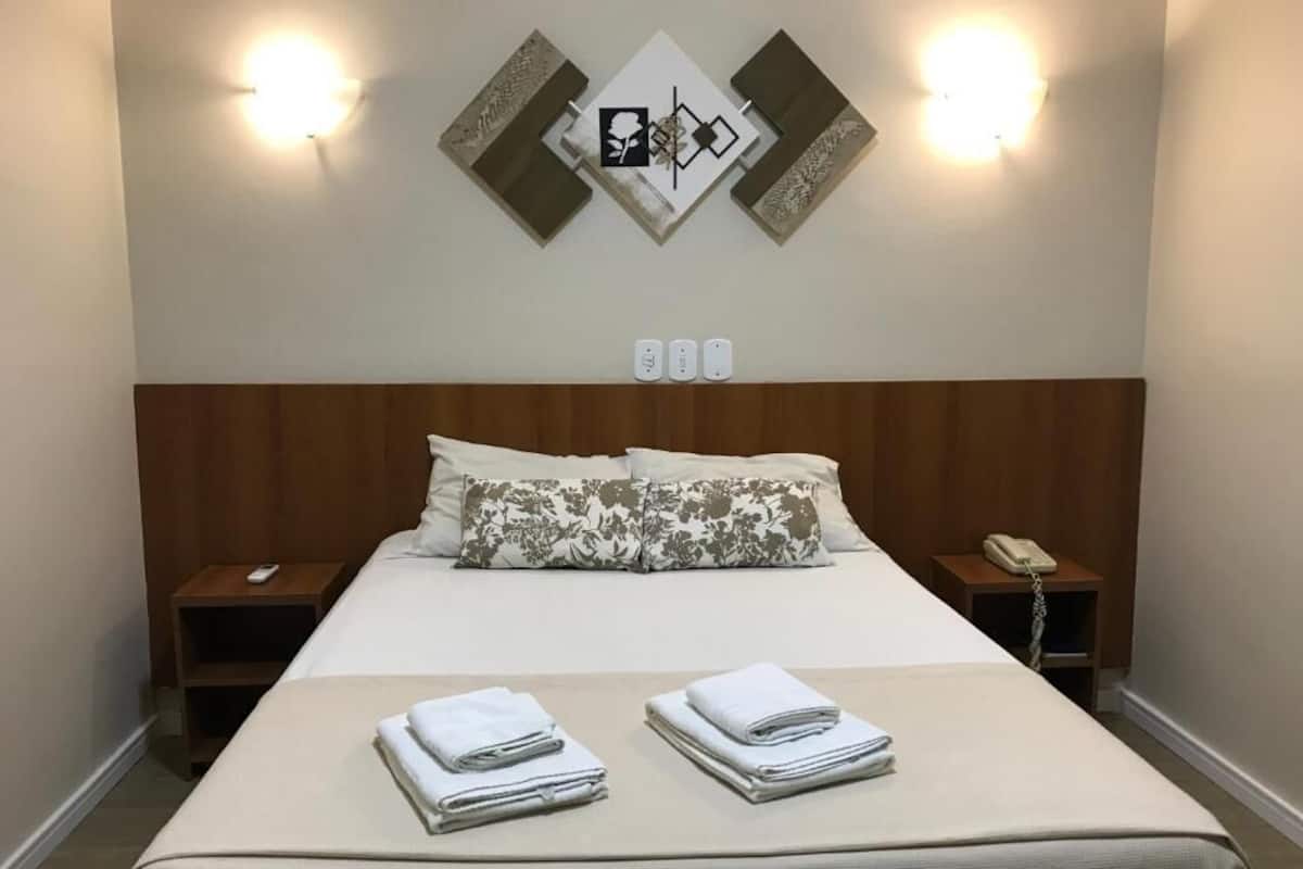 Double Room | Minibar, desk, blackout curtains, iron/ironing board