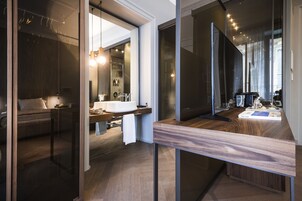 Junior Studio Suite, Balcony, City View | Bathroom | Rainfall showerhead, designer toiletries, hair dryer, slippers