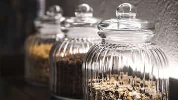 Glass jars with lids containing various grains and seeds.